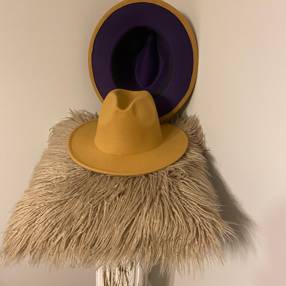Fedora hats Tan on top and Purple on Bottom.